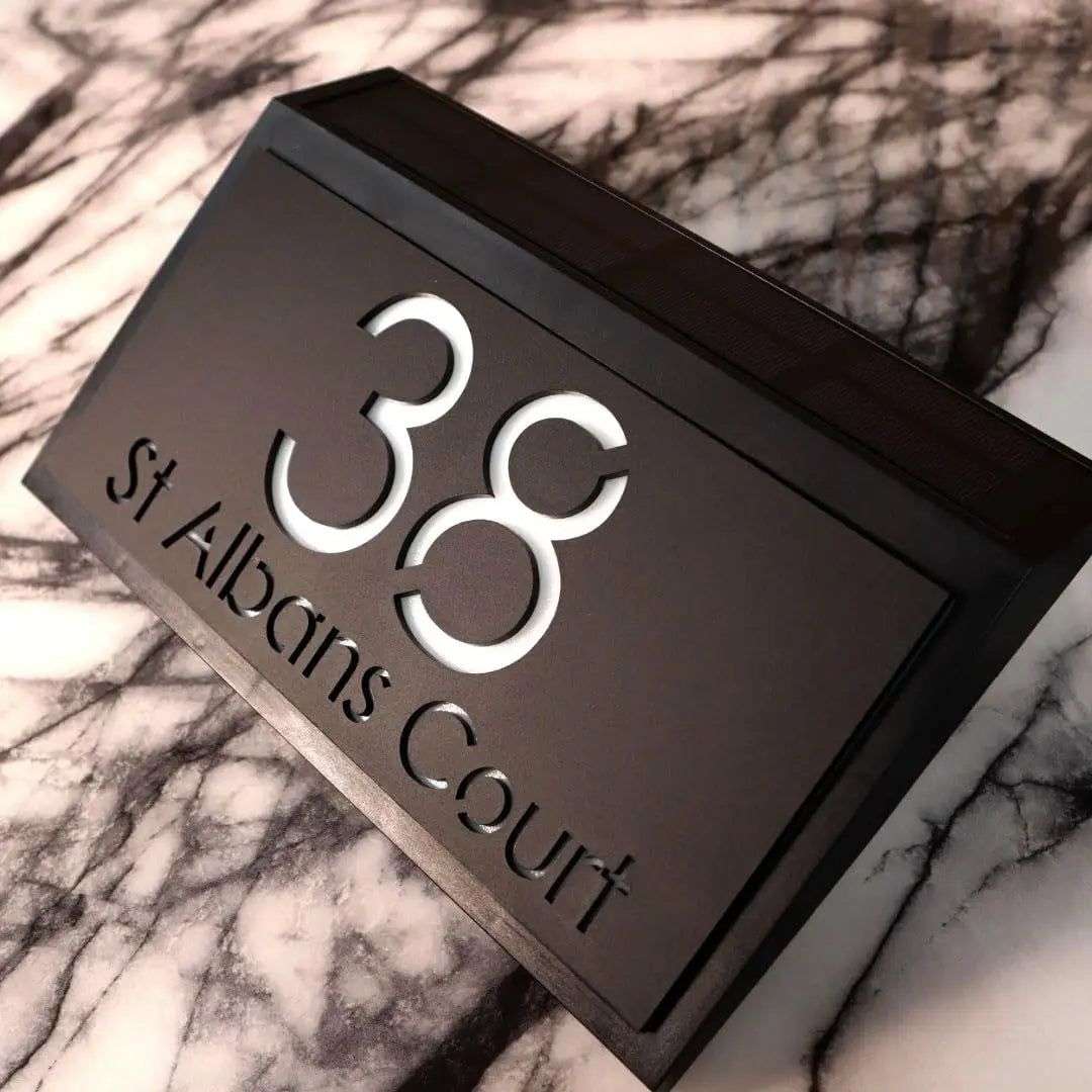 Modern solar-powered custom acrylic house sign with laser-etched address number 38 and street name St Albans Court